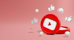 Logo di YouTube con pollici in su, simbolo dei like che favoriscono la crescita grazie alla YouTube SEO